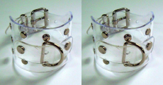 1 Paar transparente Handfesseln mit pvc-Accessoire glasklar mit D-Ringen Ziernieten und Rollschnallen-Verschluß